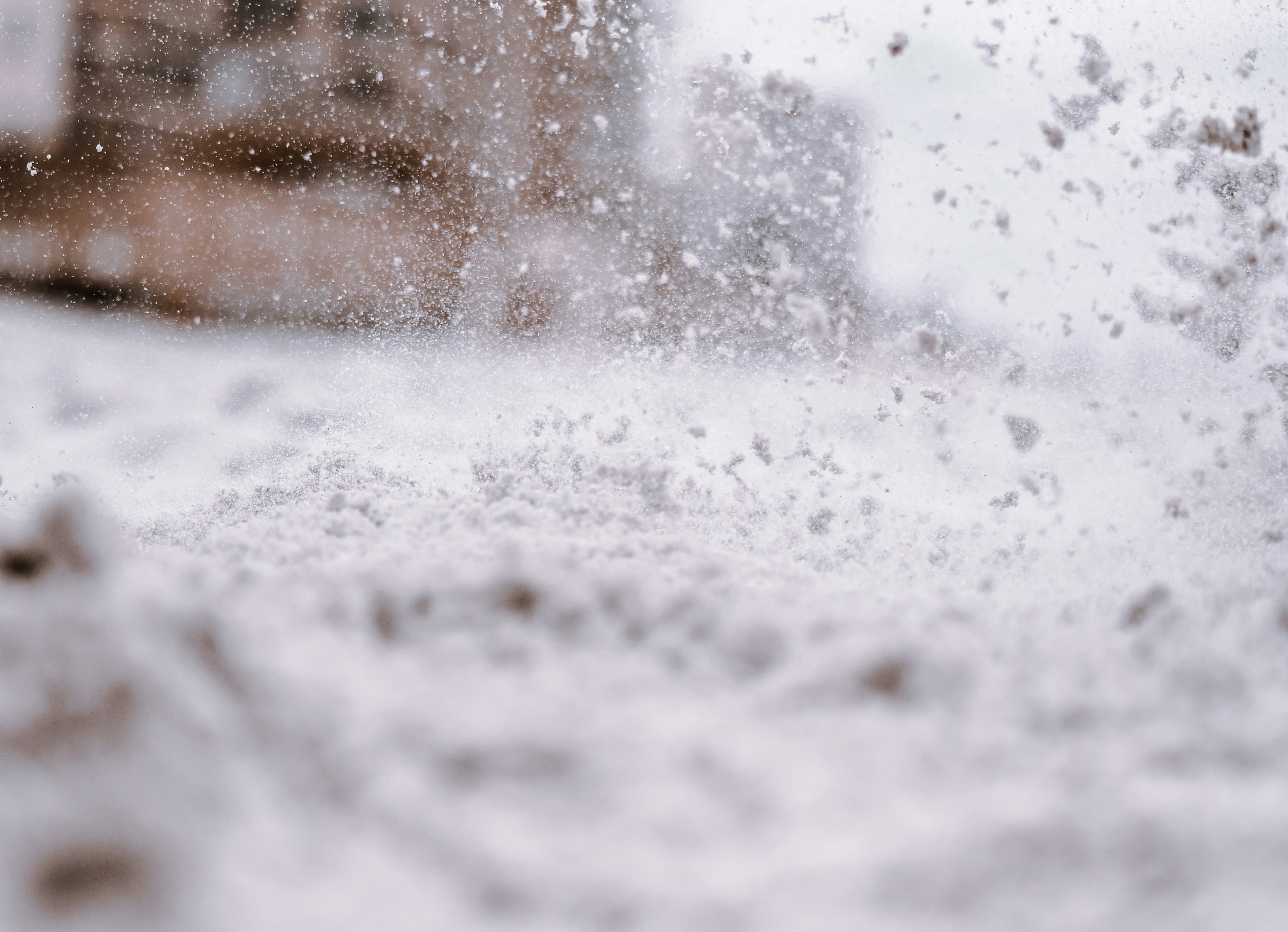 Commercial snow removal with a front-end loader in Troy, MI