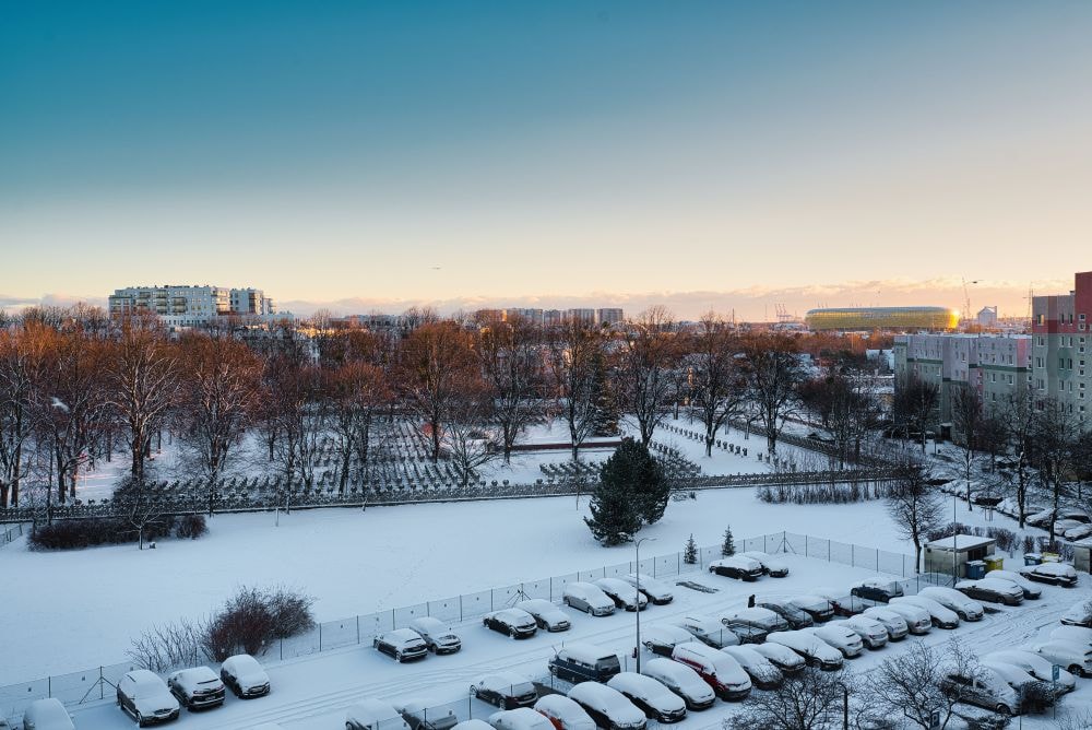 Snow-covered commercial property managed with zero tolerance snow removal in Oakland County
